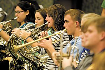 Decatur Youth Symphony Orchestra baton being passed to members