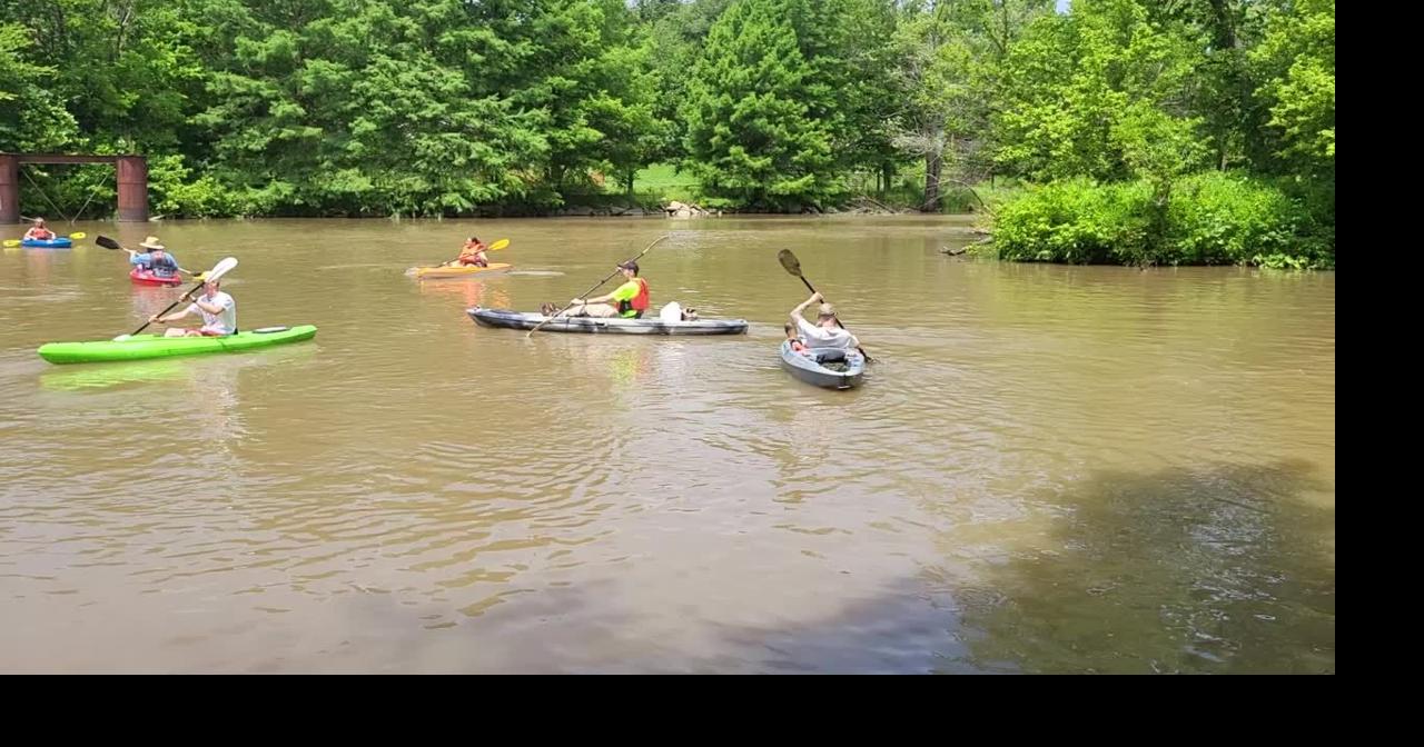 Kayakers paddle down rhe Embarras River