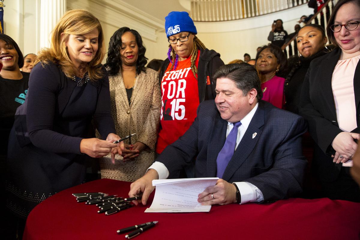 Gov. Pritzker signs law raising Illinois' minimum wage to 15 an hour