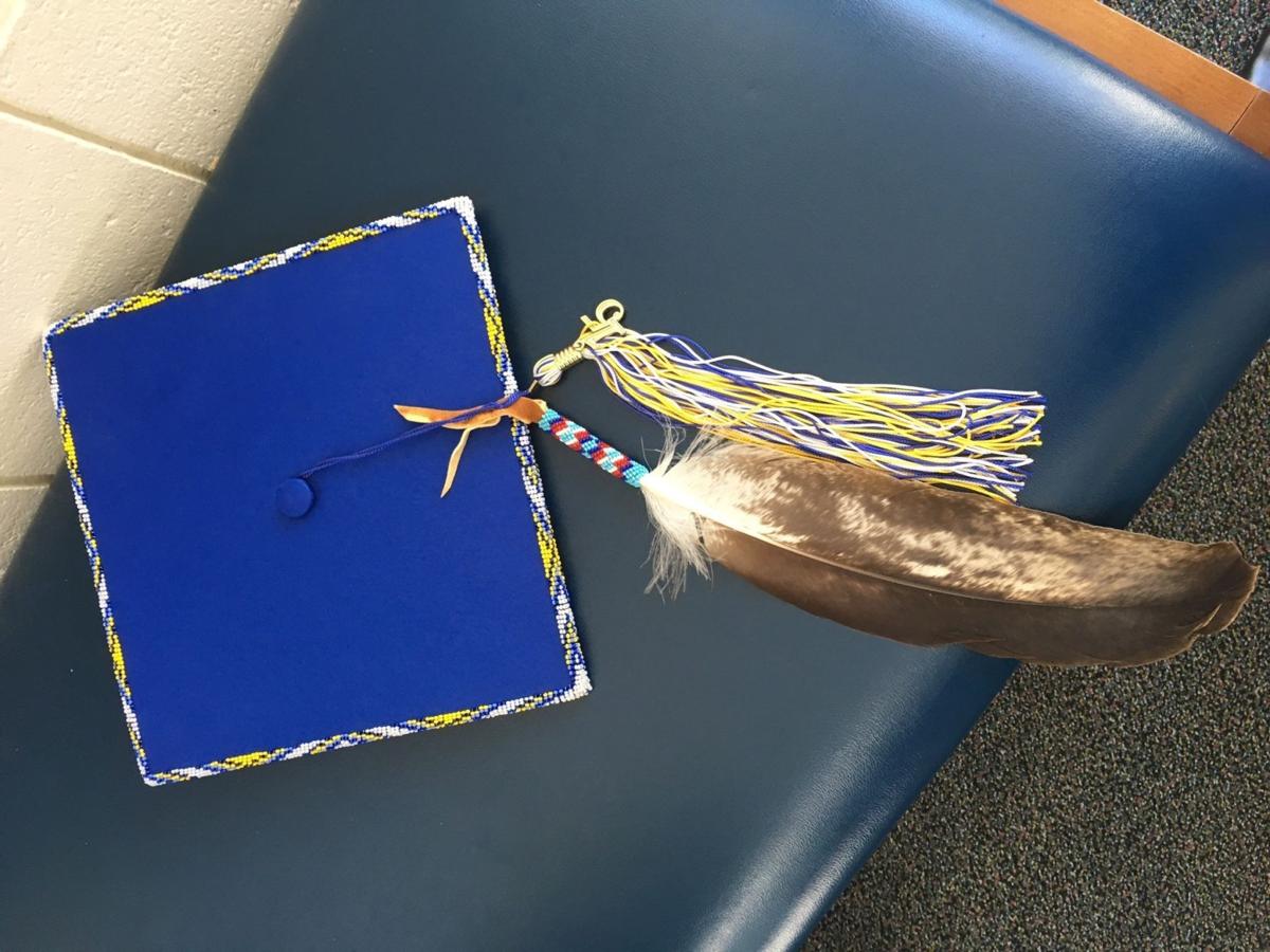 Grads can wear feathers on caps