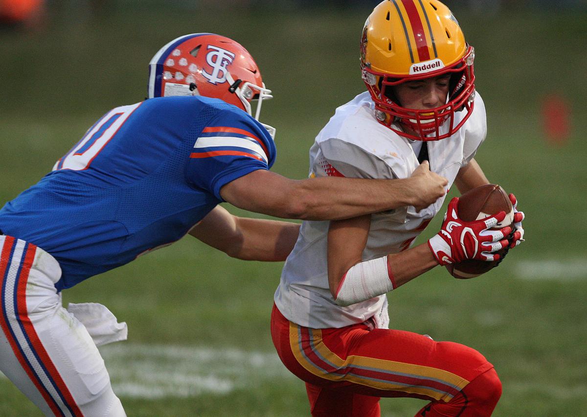 FOOTBALL NOTEBOOK WarrensburgLatham coach Aaron Fricke overseeing
