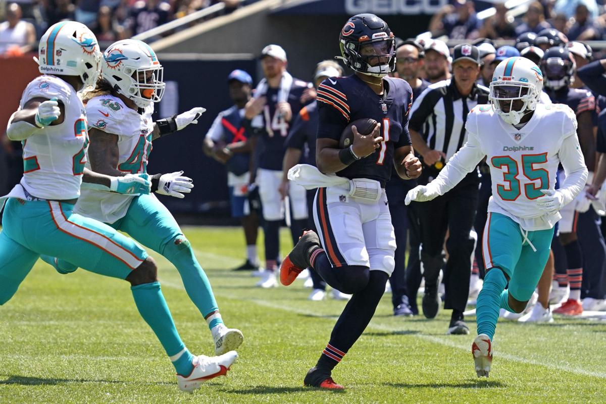 CHICAGO, IL - AUGUST 14: Chicago Bears strong safety Jordan Lucas (23) runs  with the football in warmups during a preseason game between the Chicago  Bears and the Miami Dolphins on August