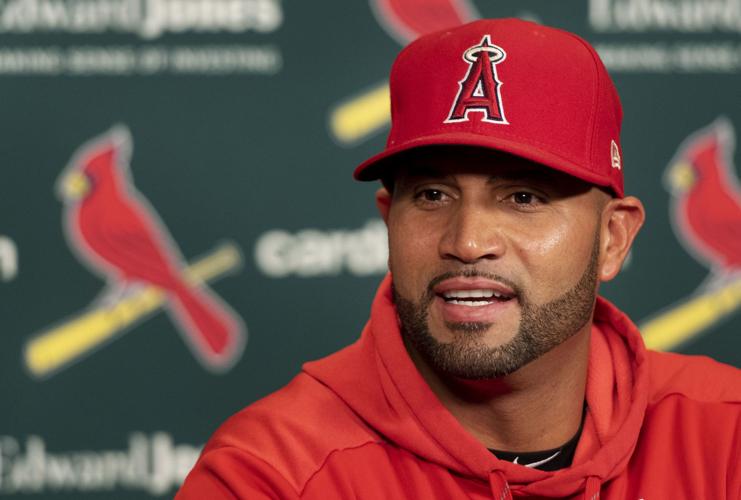 Los Angeles Angels Albert Pujols gets some driving help from his