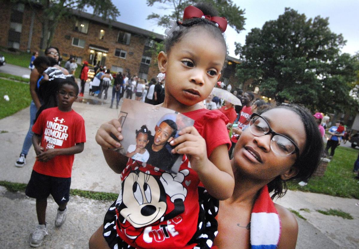 Bloomington shooting victims mourned, answers sought at vigil