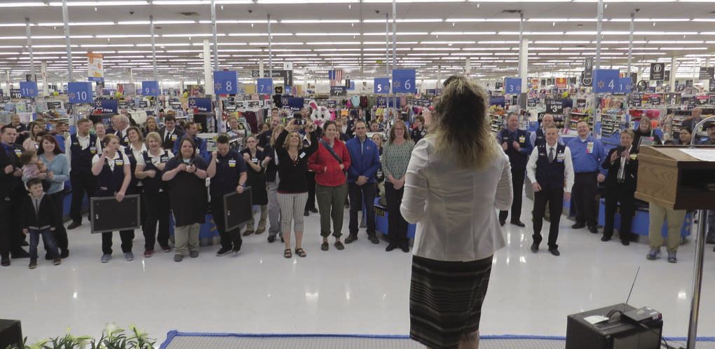 Walmart staff welcomes customers to remodeled Richardson location