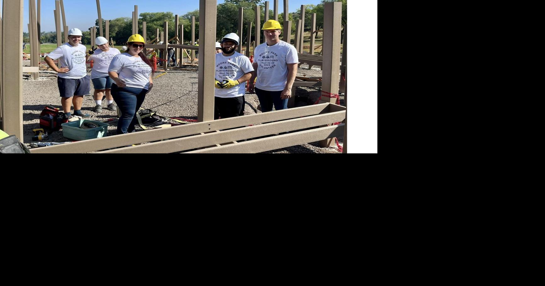 Volunteers help build ADA-accessible playground in Moore Park