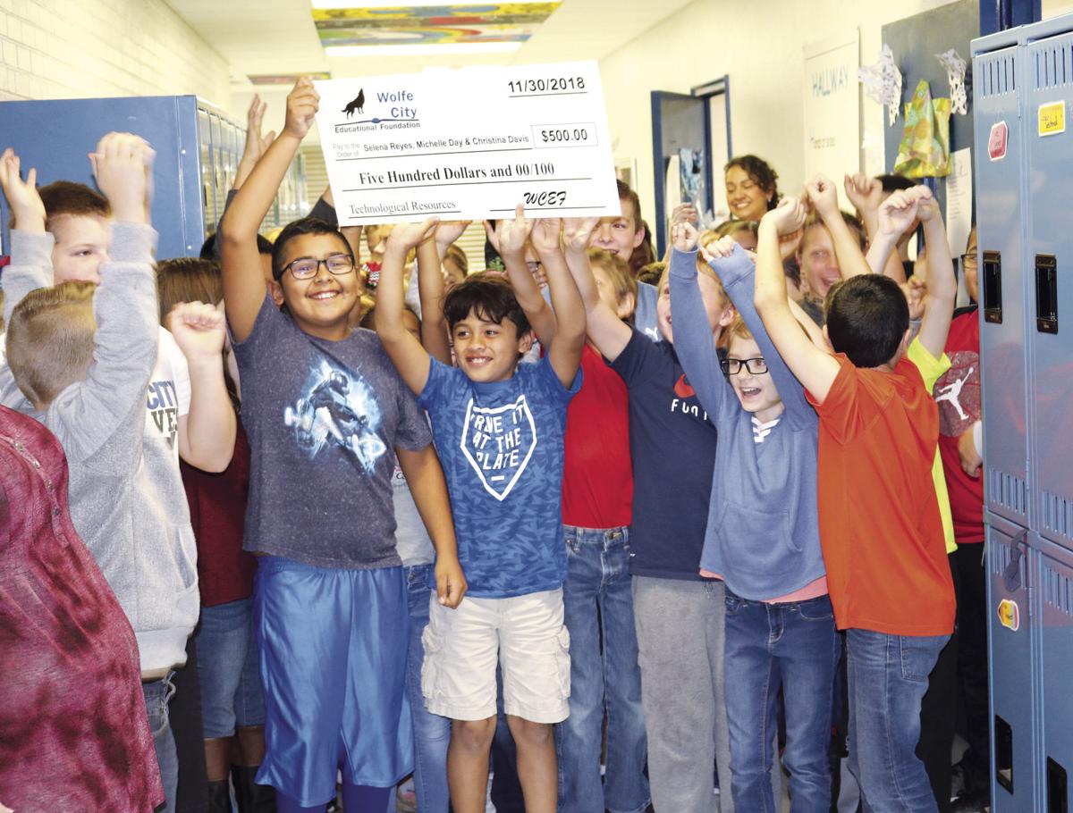 Parade of teacher, classroom grants lights up Wolfe City ISD Local