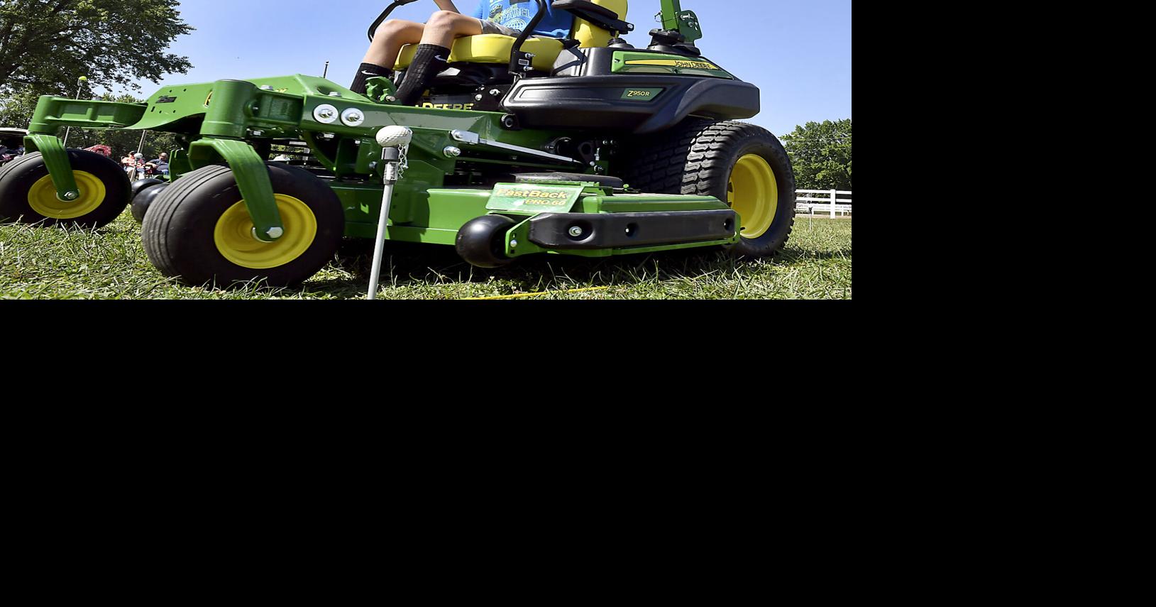 4-H members weave their way through tractor driving obstacle ...