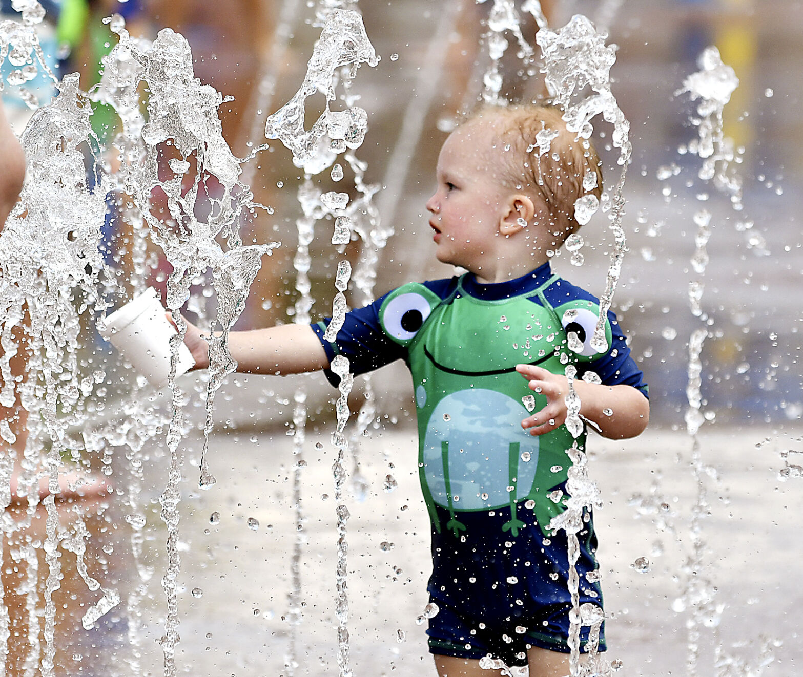 Splash pads offer inexpensive relief from blistering heatwave