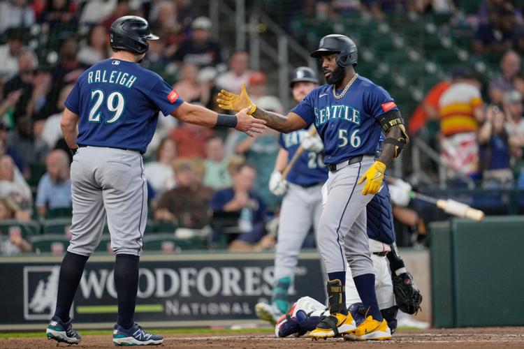 Cal Raleigh tried a full-uniform shower. The next night, his bat ...