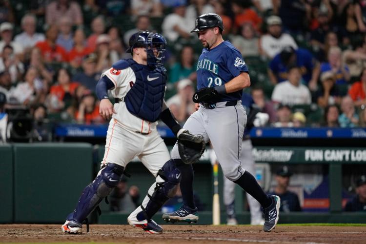 Cal Raleigh tried a full-uniform shower. The next night, his bat ...