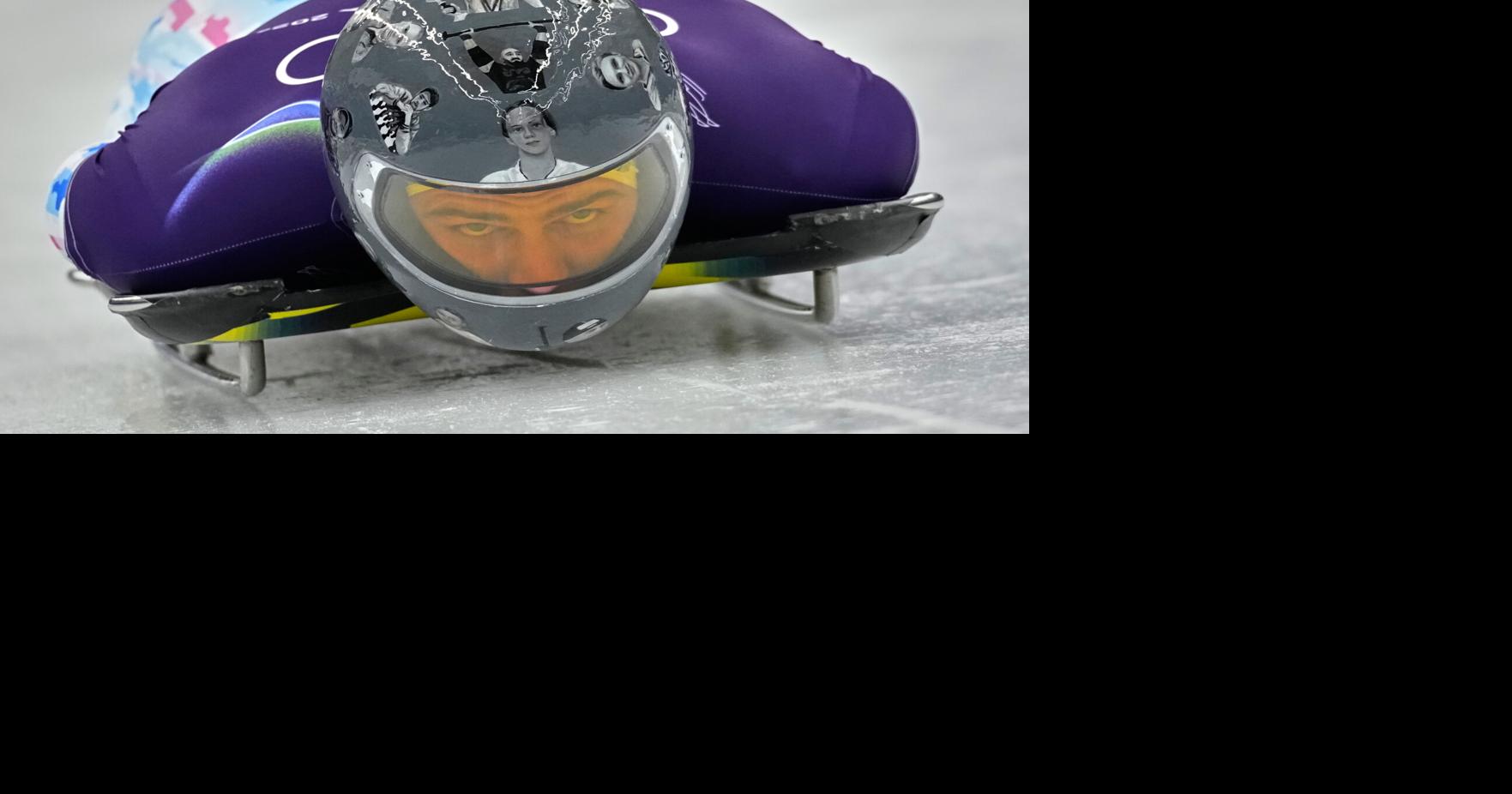 Ukrainian trains in helmet honoring fellow athletes killed in war