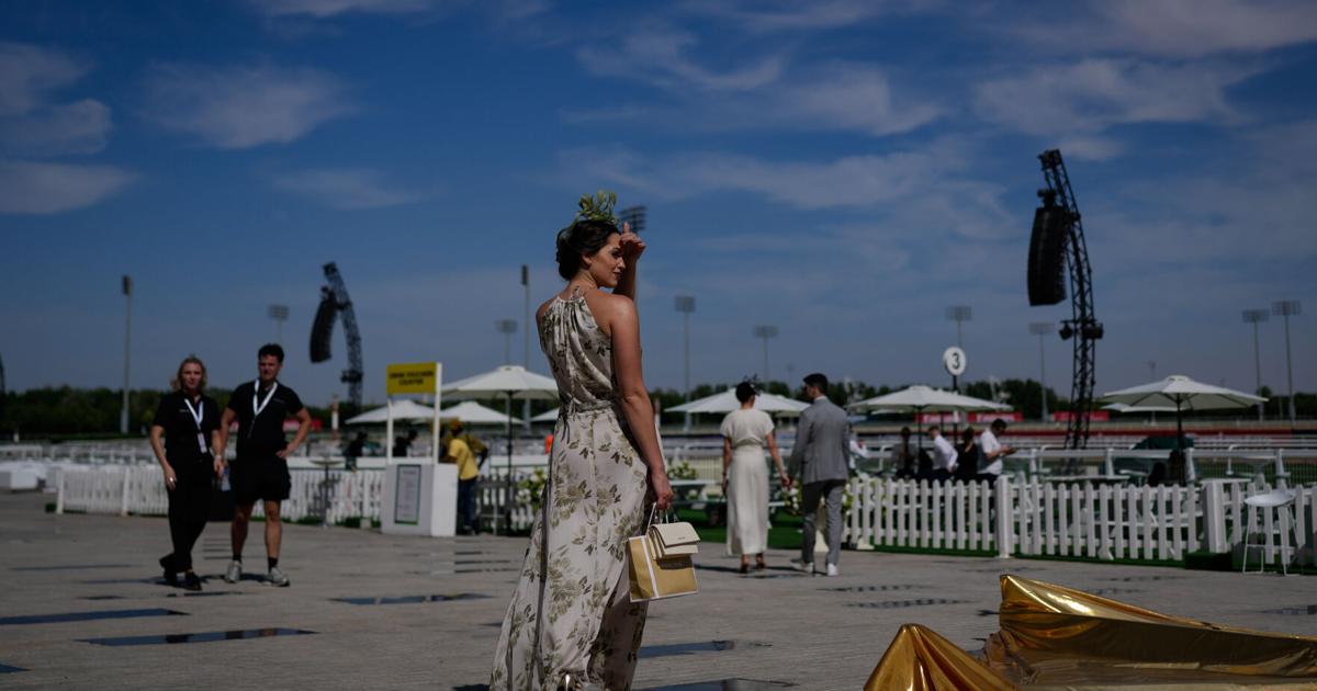 Photos show glamour at the Dubai World Cup horse race but thinner crowds due to Iran war