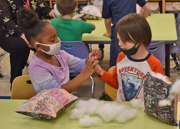Coloma Elementary School students get festive with holiday pillows