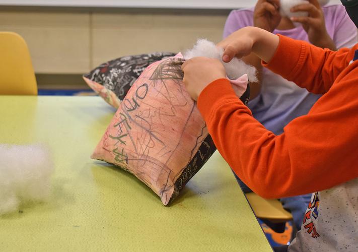 Coloma Elementary School students get festive with holiday pillows Coloma