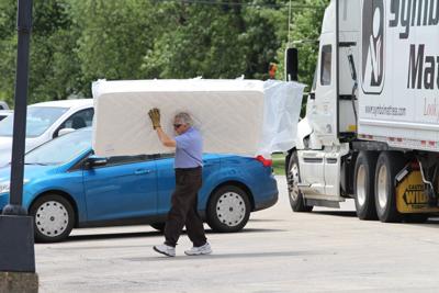 A Local Treasure Bill Leiser Still Hustling Furniture At Age 80 Bill Leiser Carrying A Mattress Across Main Street Is Still Common Scene In Downtown Herscher Who Grew Up The Family Business Turns 80 Next