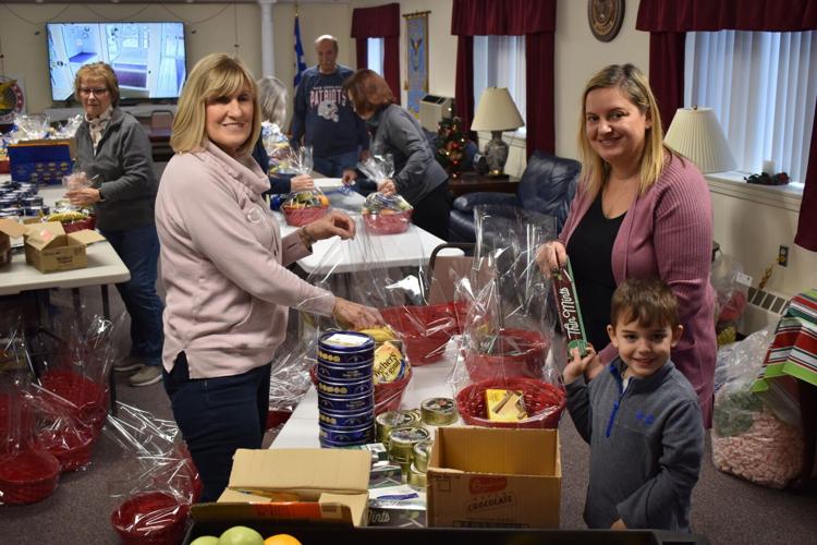 Volunteers with AHEPA 39 assemble food baskets for the elderly