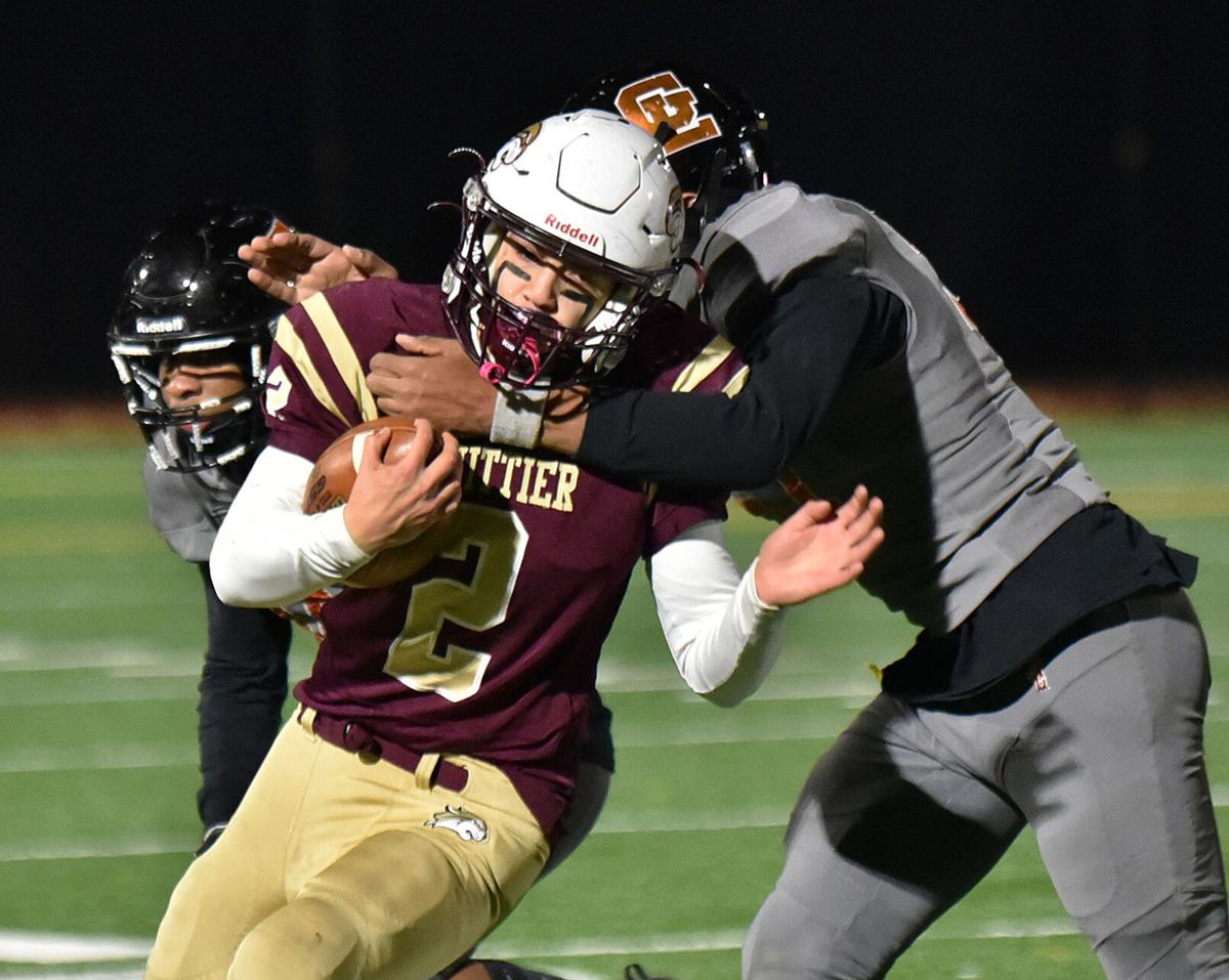 The Greater Lawrence Reggies defeated the Whittier Tech. Wildcats 28-22 in their annual Thanksgiving Eve football game.