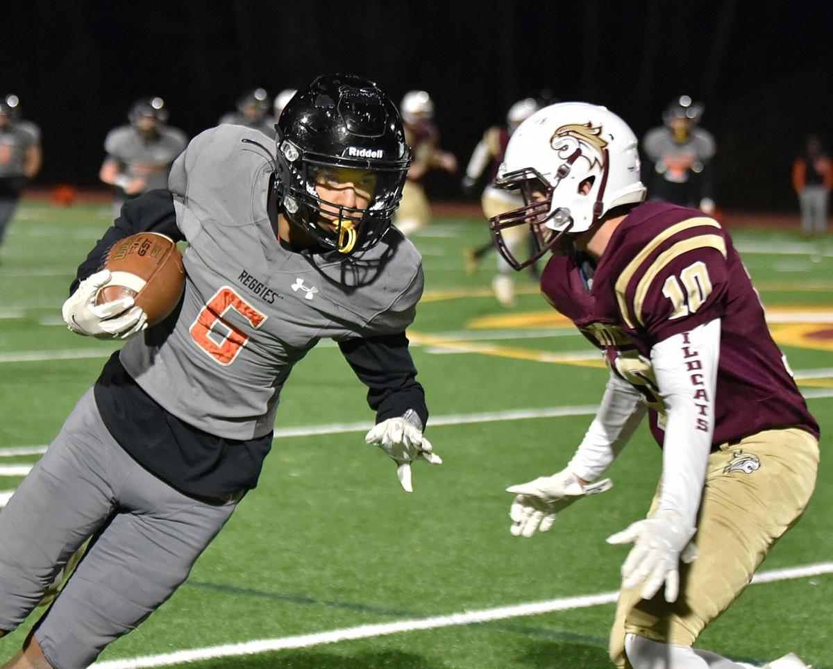 The Greater Lawrence Reggies defeated the Whittier Tech. Wildcats 28-22 in their annual Thanksgiving Eve football game.