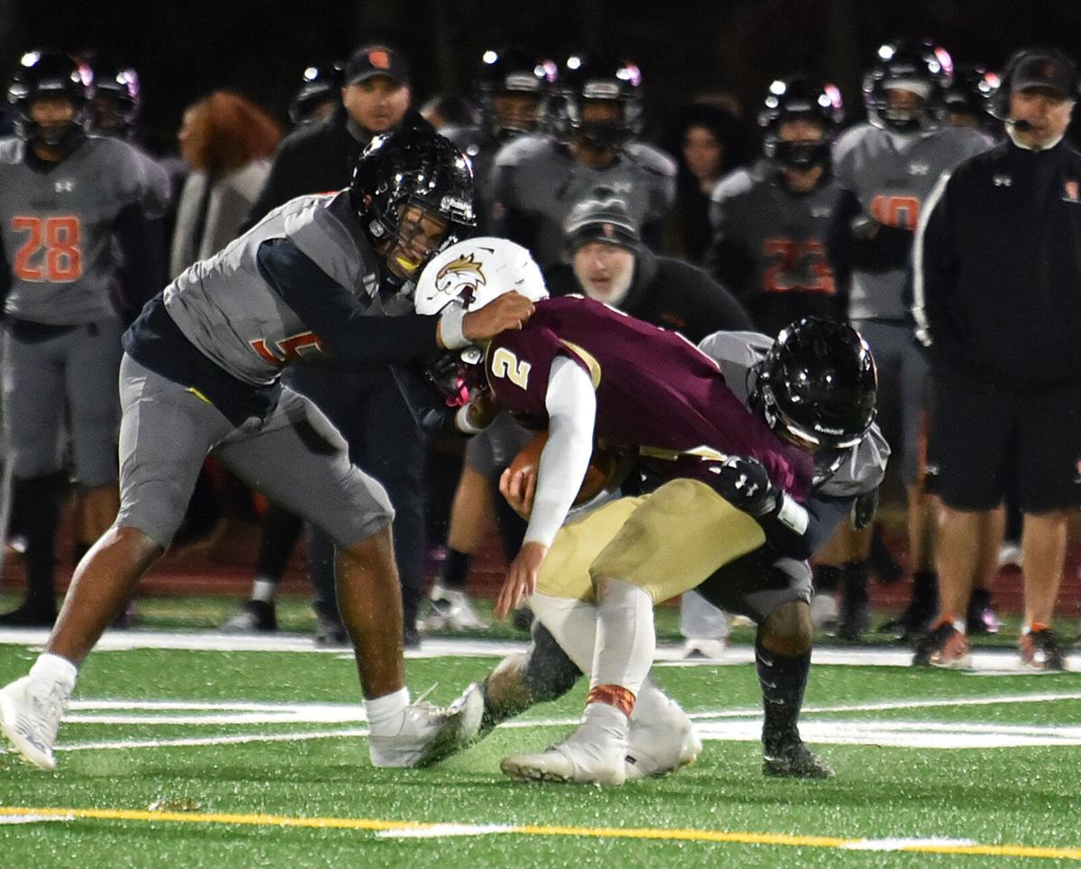 The Greater Lawrence Reggies defeated the Whittier Tech. Wildcats 28-22 in their annual Thanksgiving Eve football game.