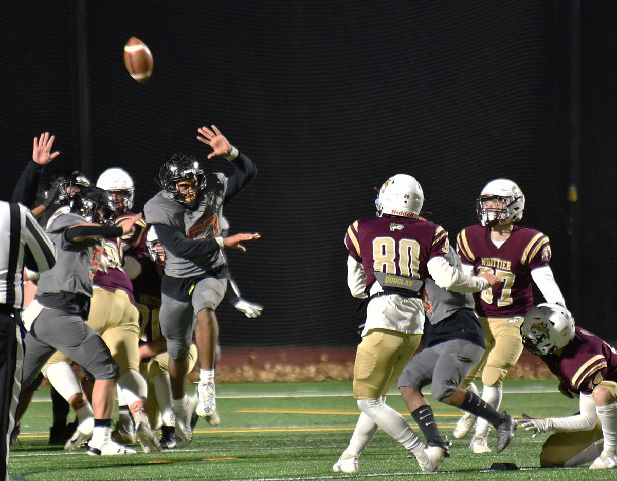 The Greater Lawrence Reggies defeated the Whittier Tech. Wildcats 28-22 in their annual Thanksgiving Eve football game.