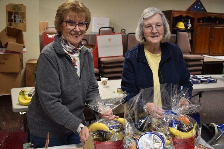 Volunteers with AHEPA 39 assemble food baskets for the elderly