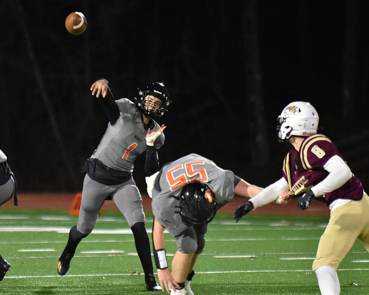 The Greater Lawrence Reggies defeated the Whittier Tech. Wildcats 28-22 in their annual Thanksgiving Eve football game.