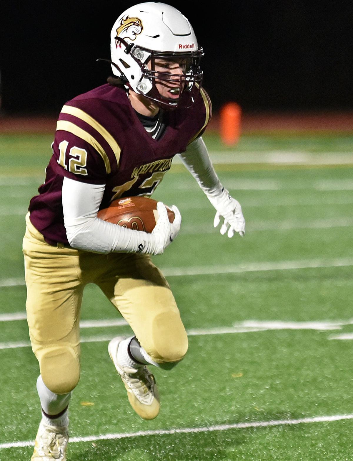 The Greater Lawrence Reggies defeated the Whittier Tech. Wildcats 28-22 in their annual Thanksgiving Eve football game.