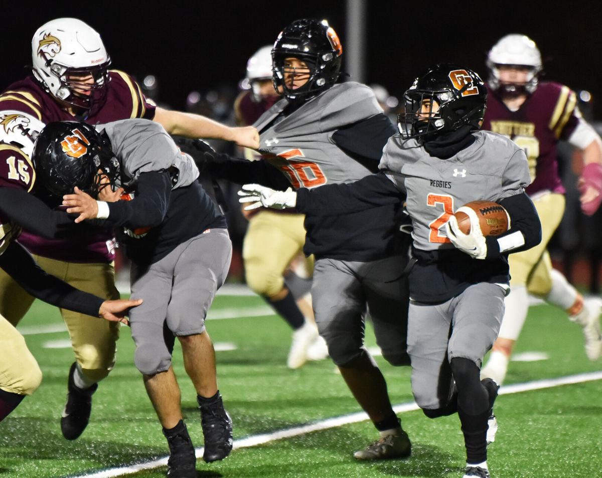 The Greater Lawrence Reggies defeated the Whittier Tech. Wildcats 28-22 in their annual Thanksgiving Eve football game.