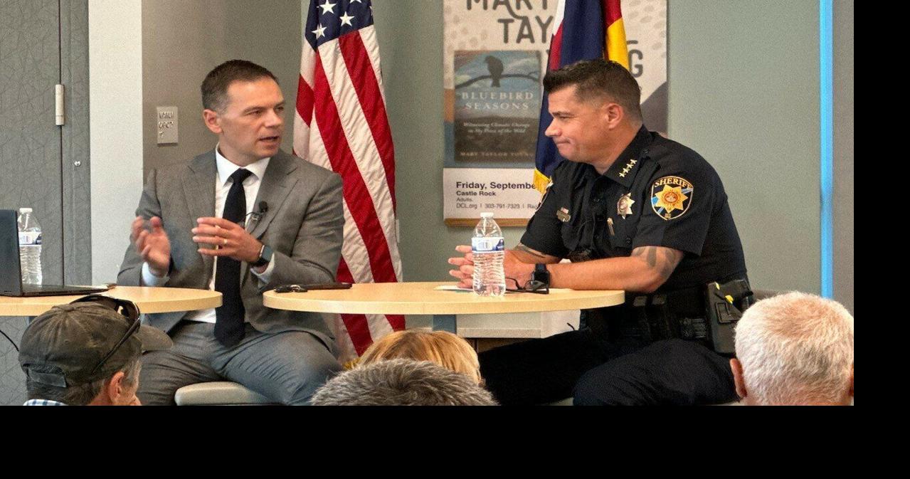 District Attorney John Kellner, Douglas County Sheriff Darren Weekly ...
