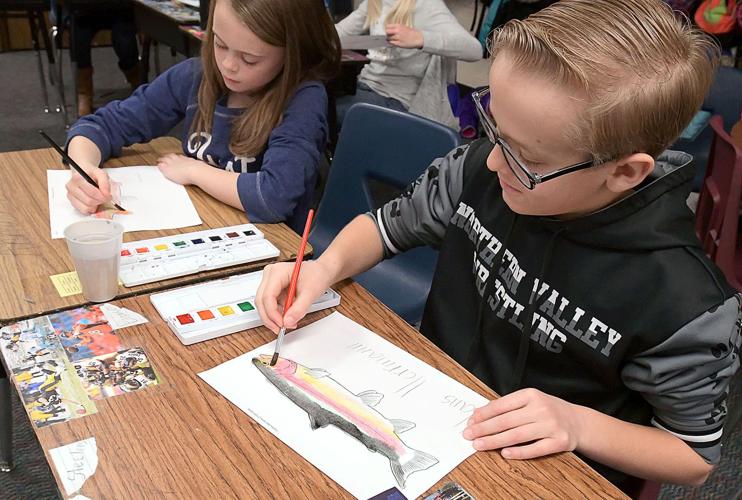 Slippery science Elementary students raise trout in classrooms