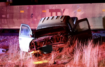 Pickup collides with train