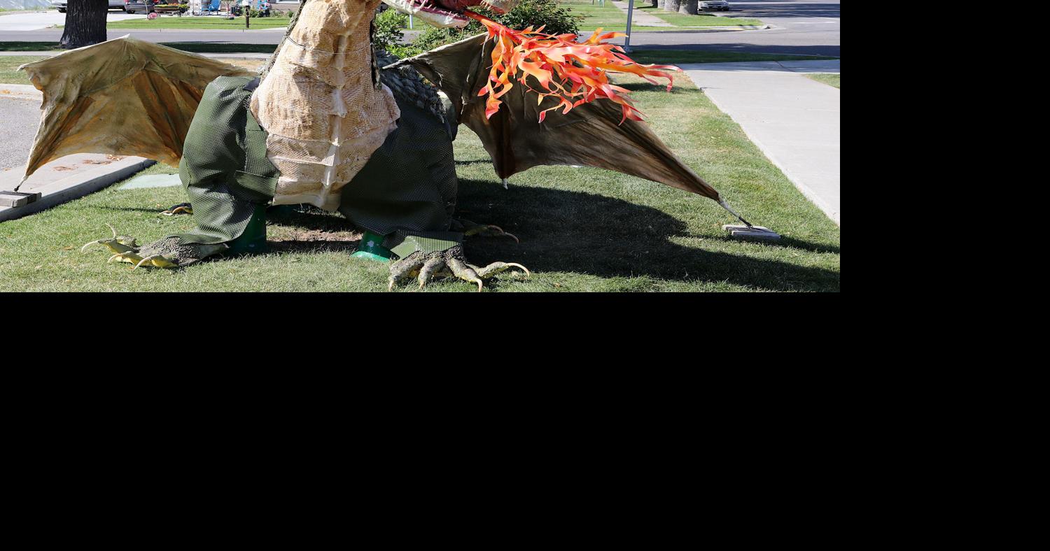 Summer scorcher: Smithfield dino sculpture sprouts wings, spouts fire ...