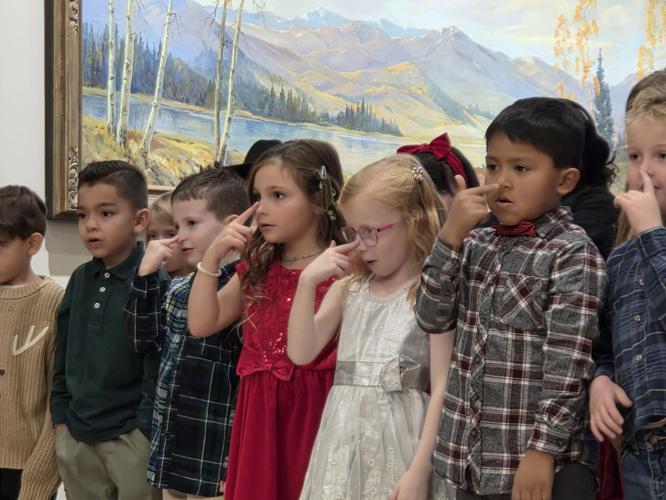 Ellis Elementary students sing, decorate tree at annual Zions Bank ...
