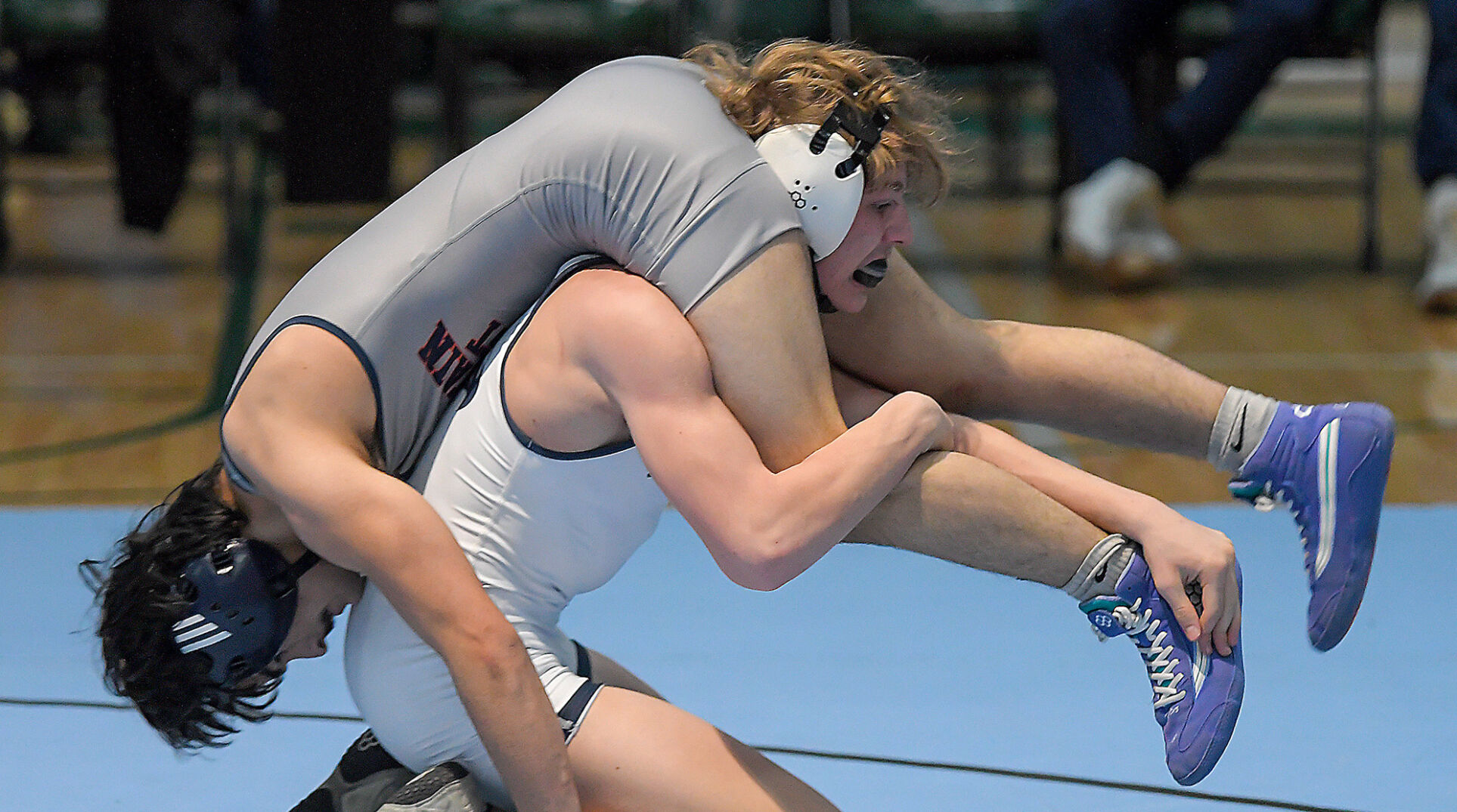Local Athletes Dominate High School Boys’ Wrestling Tournament with Eight Divisional Titles