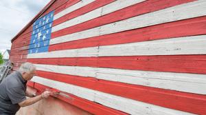 Patriotism in plain sight: Local continues American flag-painting project