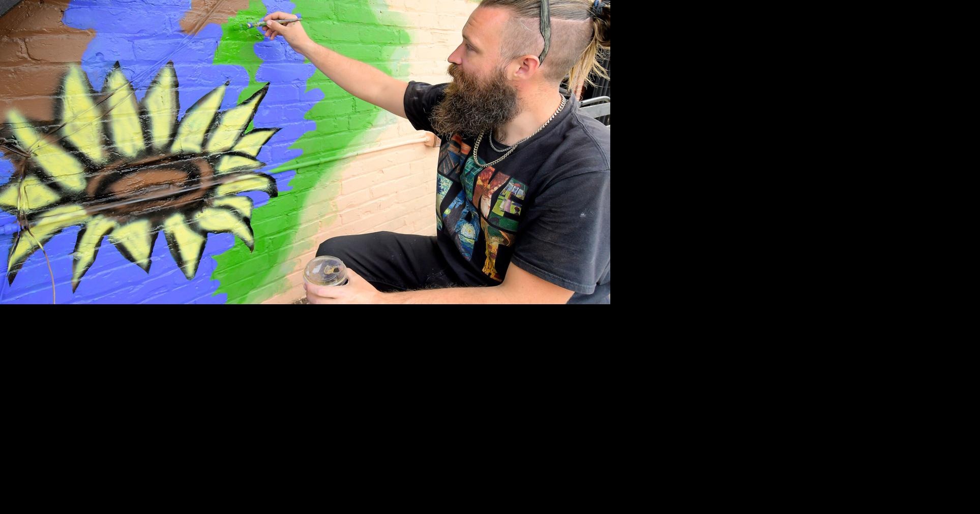 Painting the town: Local artists create mural for The Sportsman ...
