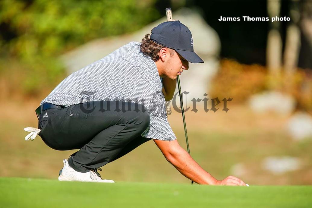 Aidan Fortunado of Shawsheen Tech lines up his putt