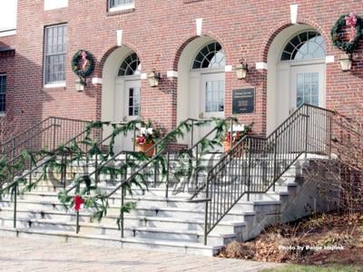Tewksbury Town Hall is decked out with pine roping, balsam wreaths, and planters for the holidays