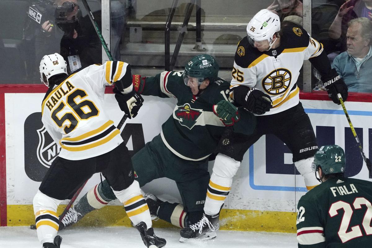 Boston Bruins place forwards Brad Marchand, Craig Smith in NHL's