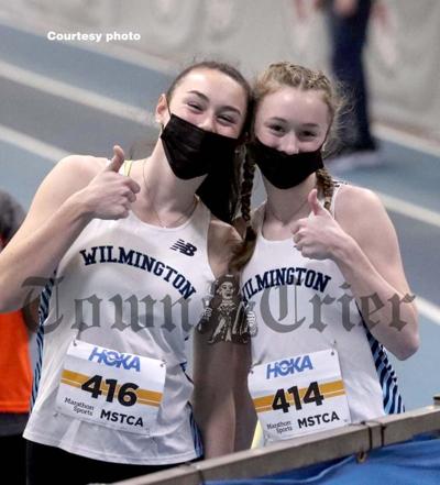 Sisters Kaitlyn (left) and Ali Doherty give thumbs up after they both qualified for the state meet in the 55-meter dash