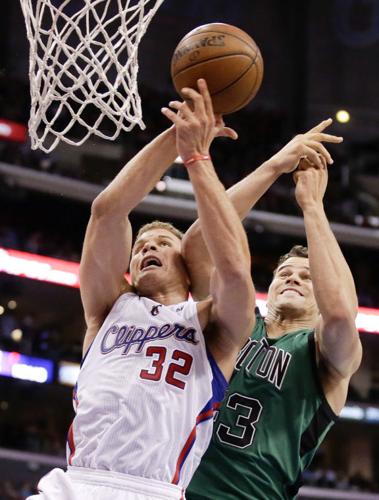 Photo: Los Angeles Clippers Blake Griffin dunks over Boston