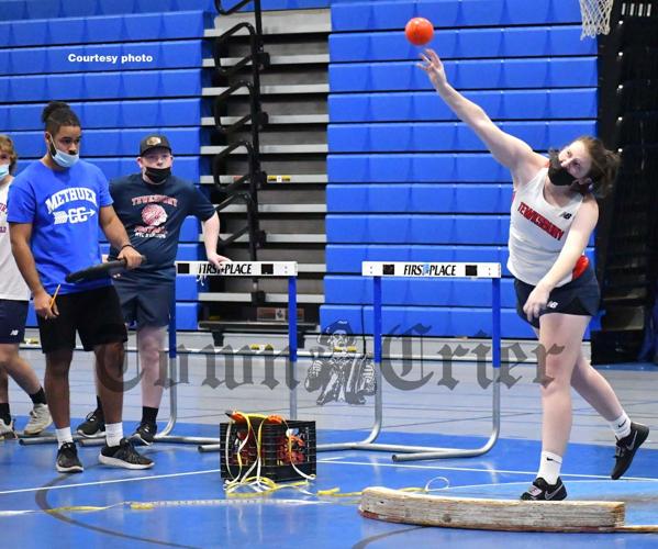 Tewksbury High’s Ava Piccolo unleashes a shot put throw