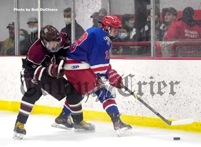 Tewksbury High forward Jeremy Insogna (18) battles for possession