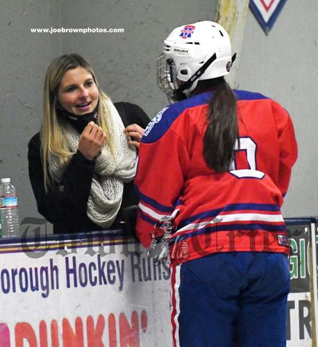 Tewksbury/Methuen Girls Hockey Coach Sarah Doucette and Jamie Constatino share a moment