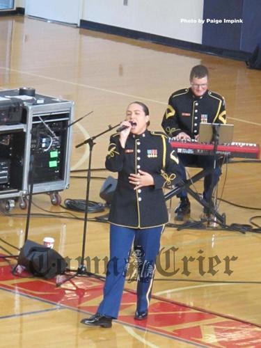 Members of the Army band Downrange performed pop tunes