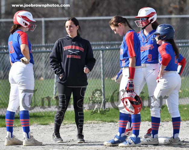 TMHS Softball Coach Brittany Souza chats with players during an earlier season game