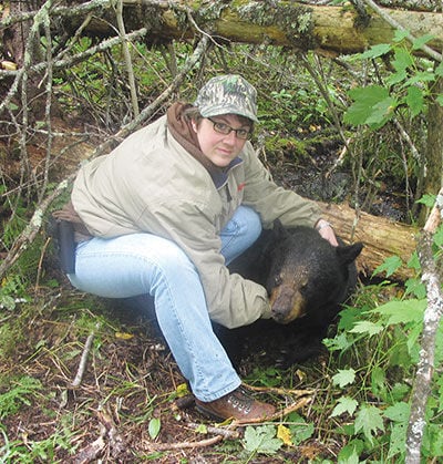 Kim Roering with first black bear.