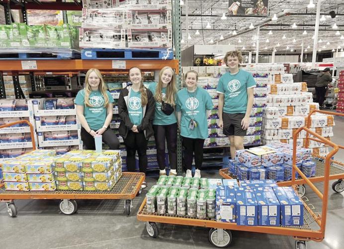 Eagan High Interact youth assemble blizzard meals for seniors