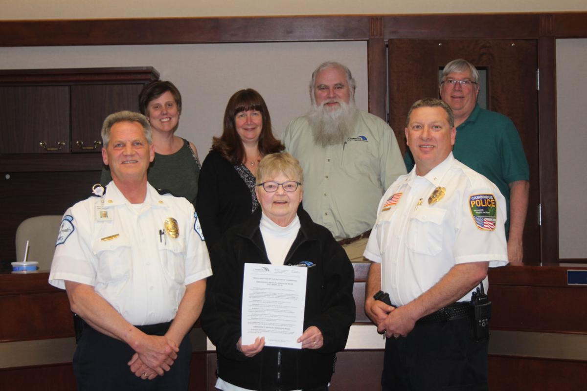 Cambridge Mayor Marlys Palmer proclaimed May 20-26 as Medical Services Week. Pictured in front are Allina Health Ambulance Operations manager Bruce Hildebrandt, Palmer and Cambridge Police Chief Todd Schuster. In back are Council Members Kersten Barfknecht Conley, Lisa Iverson, Joe Morin and Jim Godfrey. Hildebrandt mentioned in 2017 there were 1,100 calls for service in the city of Cambridge and the number continues to increase each year. Photo by Rachel Kytonen